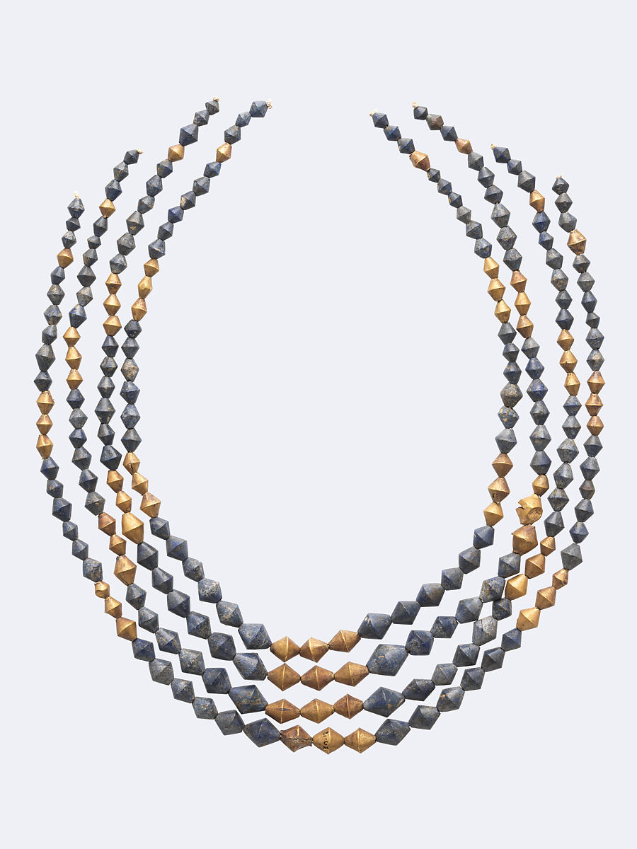 Four reconstructed strands combine gold and blue lapis lazuli beads from Ur.