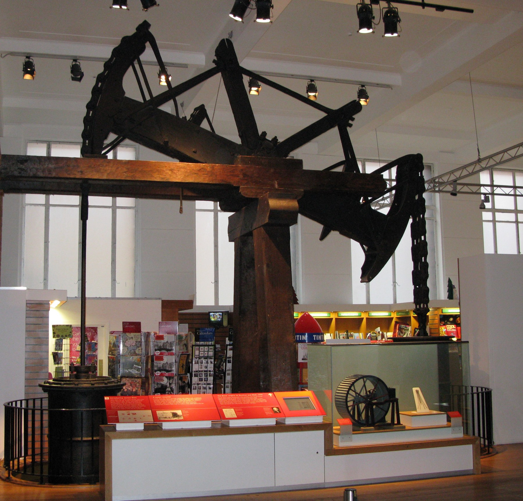 Old Bess displayed with its overhead beam and engine equipment at the Science Museum.